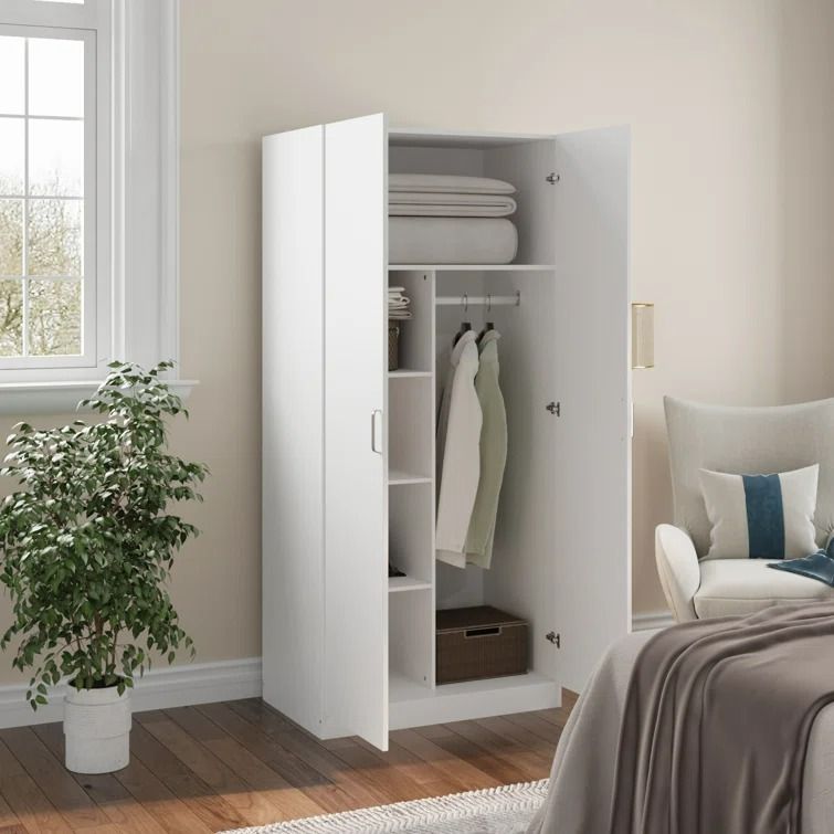 White two-door baby wardrobe with top shelf, hanging rail and side shelves