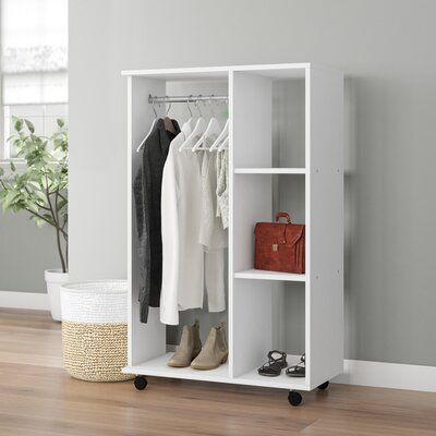 Compact white rolling baby wardrobe with hanging rail and side cubbies